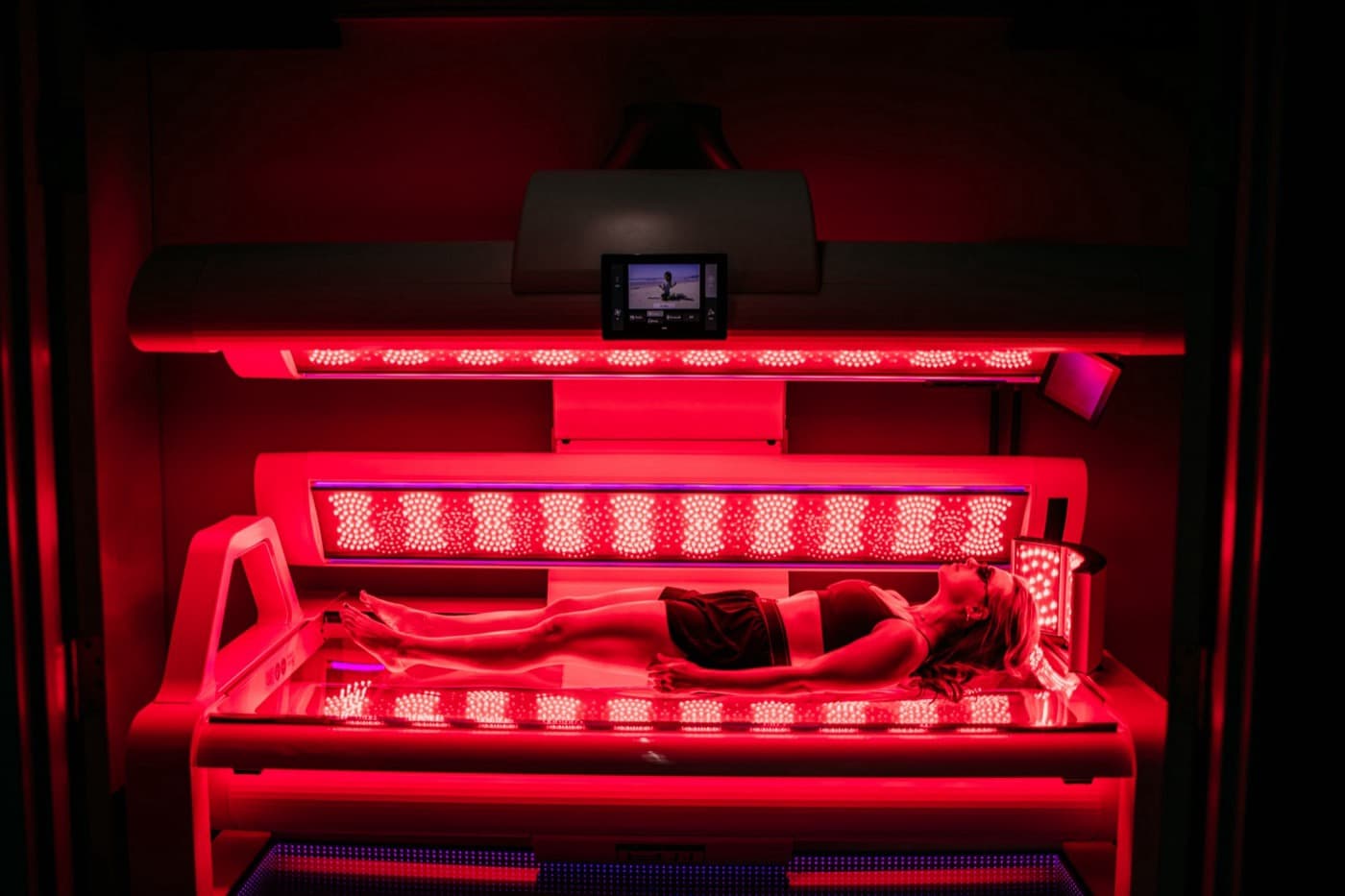 Full-body red light therapy bed in use